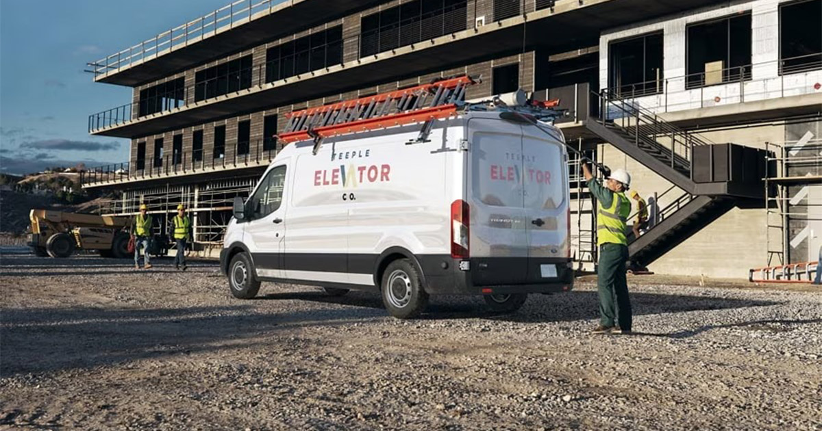 2025 Ford Commercial Van outside of a work site.