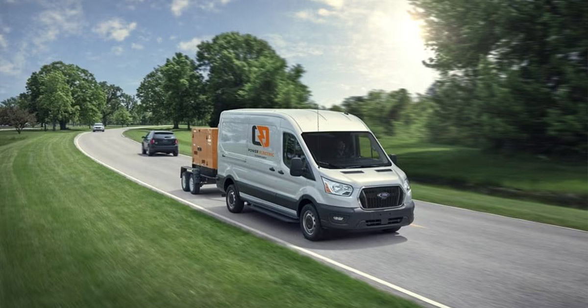 2025 Ford Commercial Van traveling to a work site.