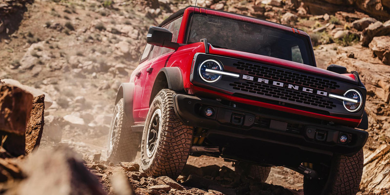 2026 Ford Bronco in red color showing its off-road capabilities