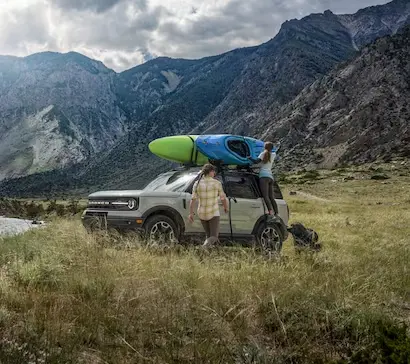 A couple loading up a Ford Bronco Sport