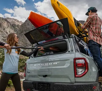 A couple loading up a Ford Bronco Sport