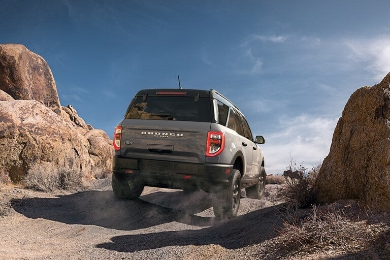 A Ford Bronco Sport driving on a rocky terrain